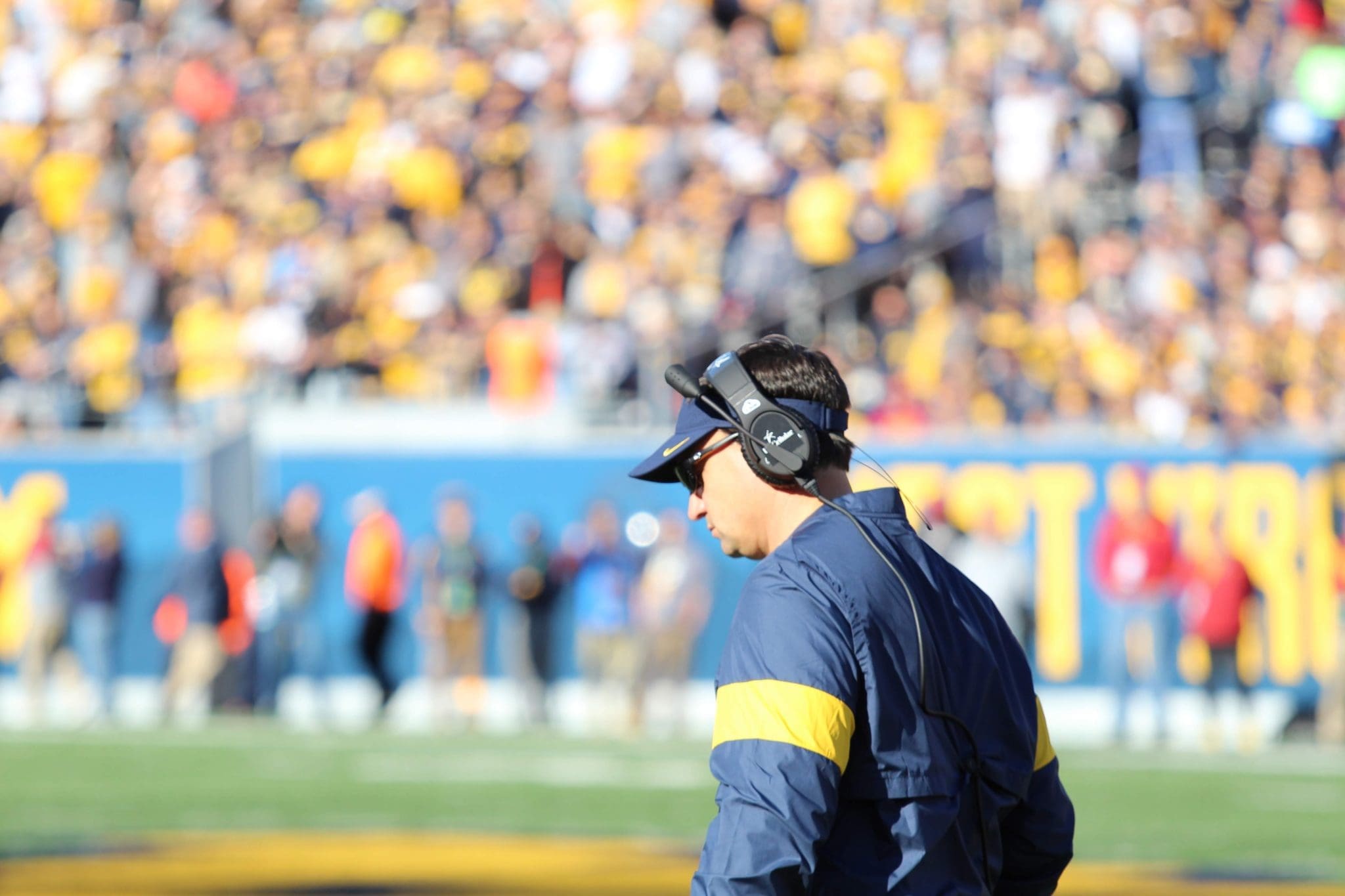 WVU Football HC Neal Brown head down
