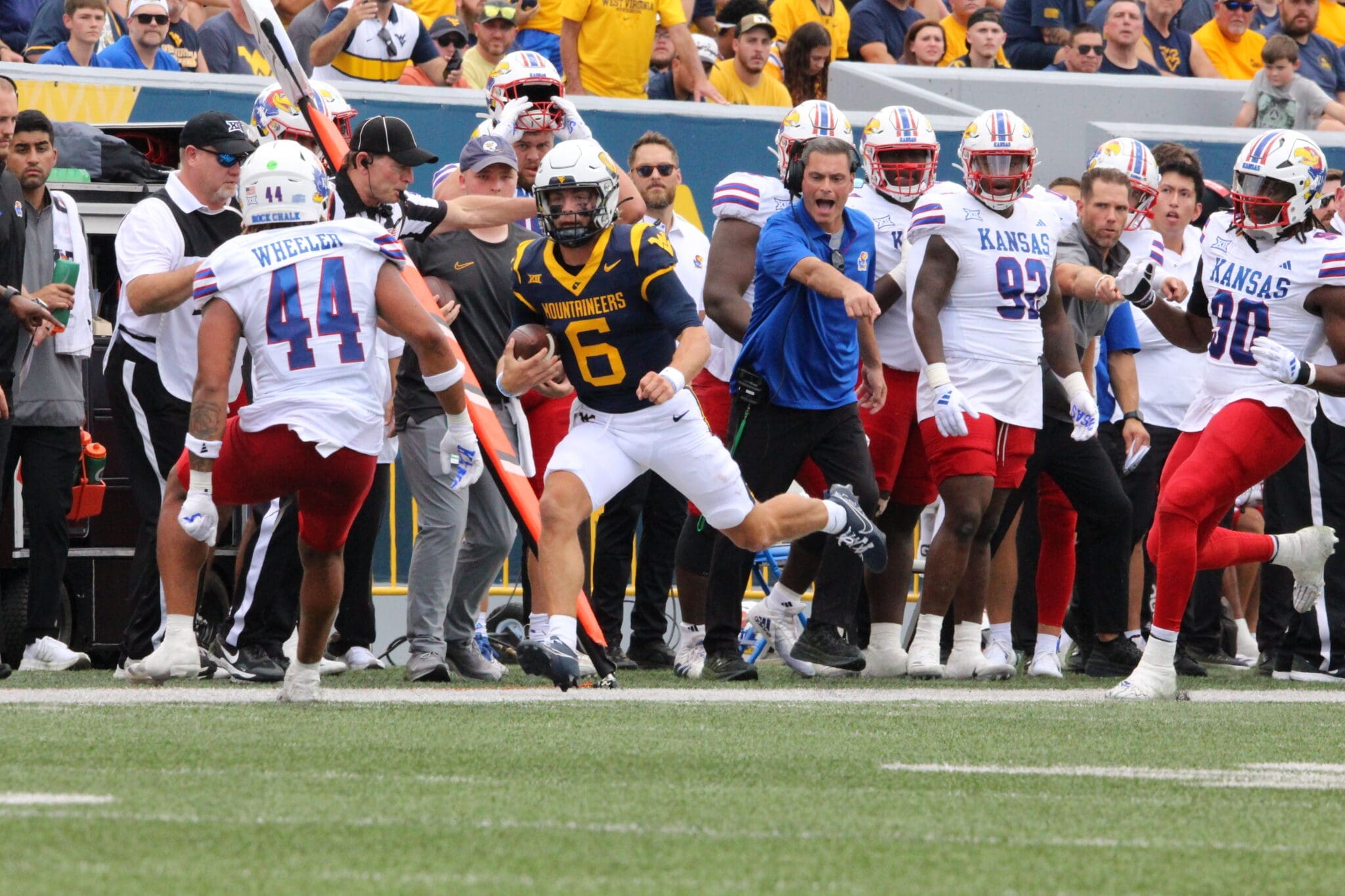 WVU Football QB Garrett Greene scrambles