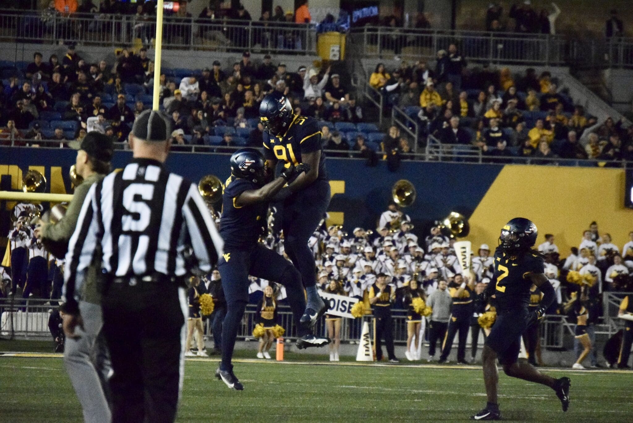 WVU Football Defense celebrates over BYU