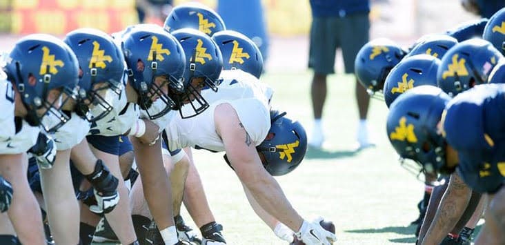 WVU Football line of scrimmage stock