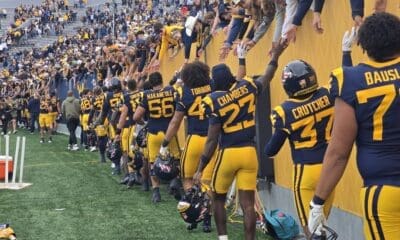 WVU Football players with fans