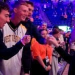 WVU Basketball HC Ross Hodge high fives students