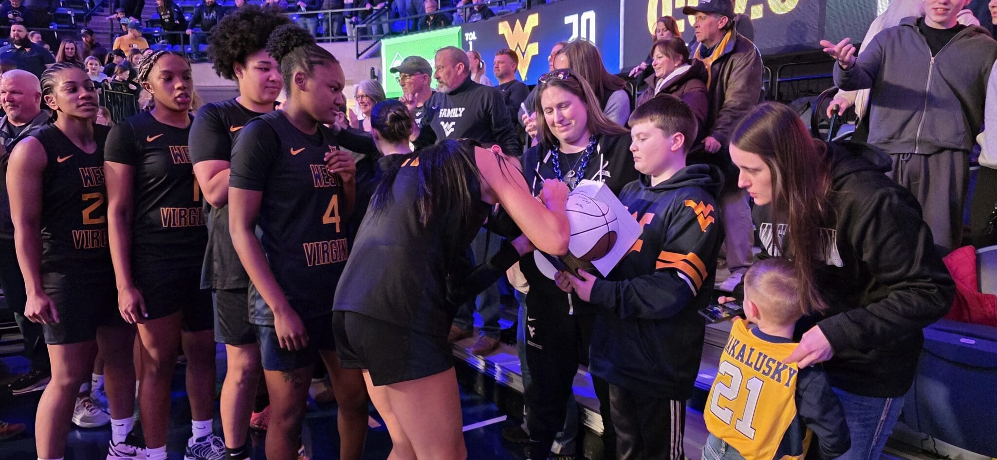 WVU Women's Basketball with fans