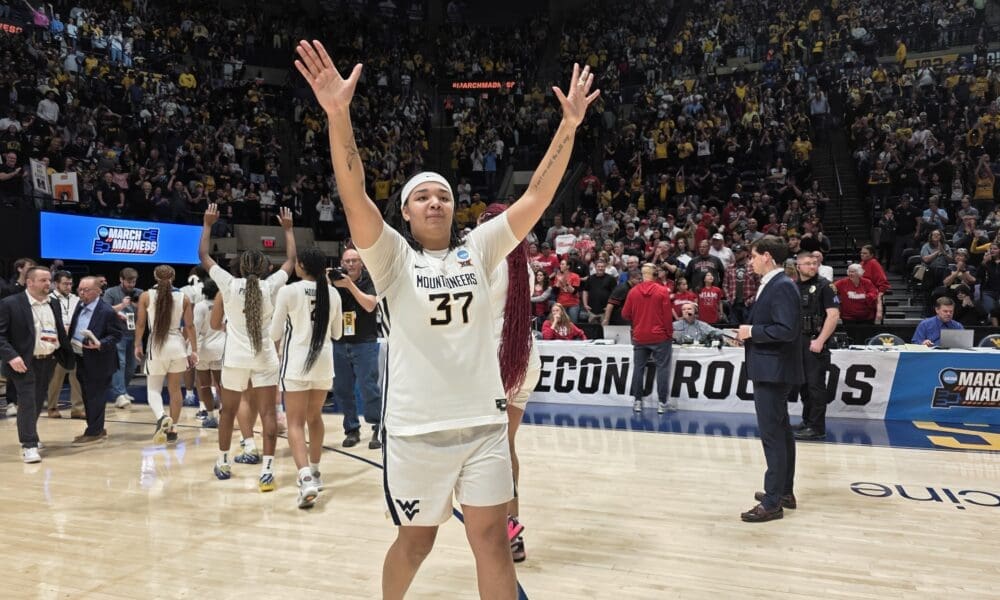 WVU Women's Basketball Celia Riviere thanks the Hope Coliseum crowd