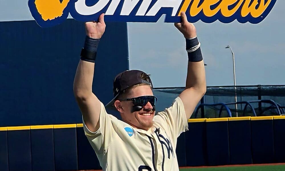 WVU Baseball Paul Schoenfeld holding Omaha sign