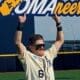 WVU Baseball Paul Schoenfeld holding Omaha sign