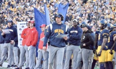 WVU Football HC Neal Brown on sidelines with Bilal Marshall