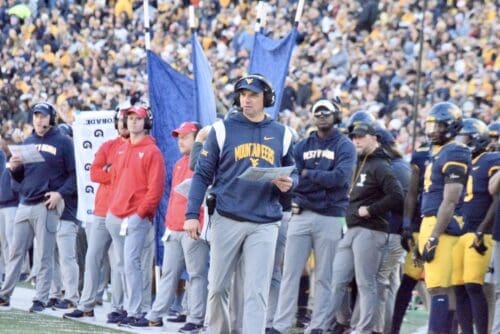 WVU Football HC Neal Brown on sidelines with Bilal Marshall