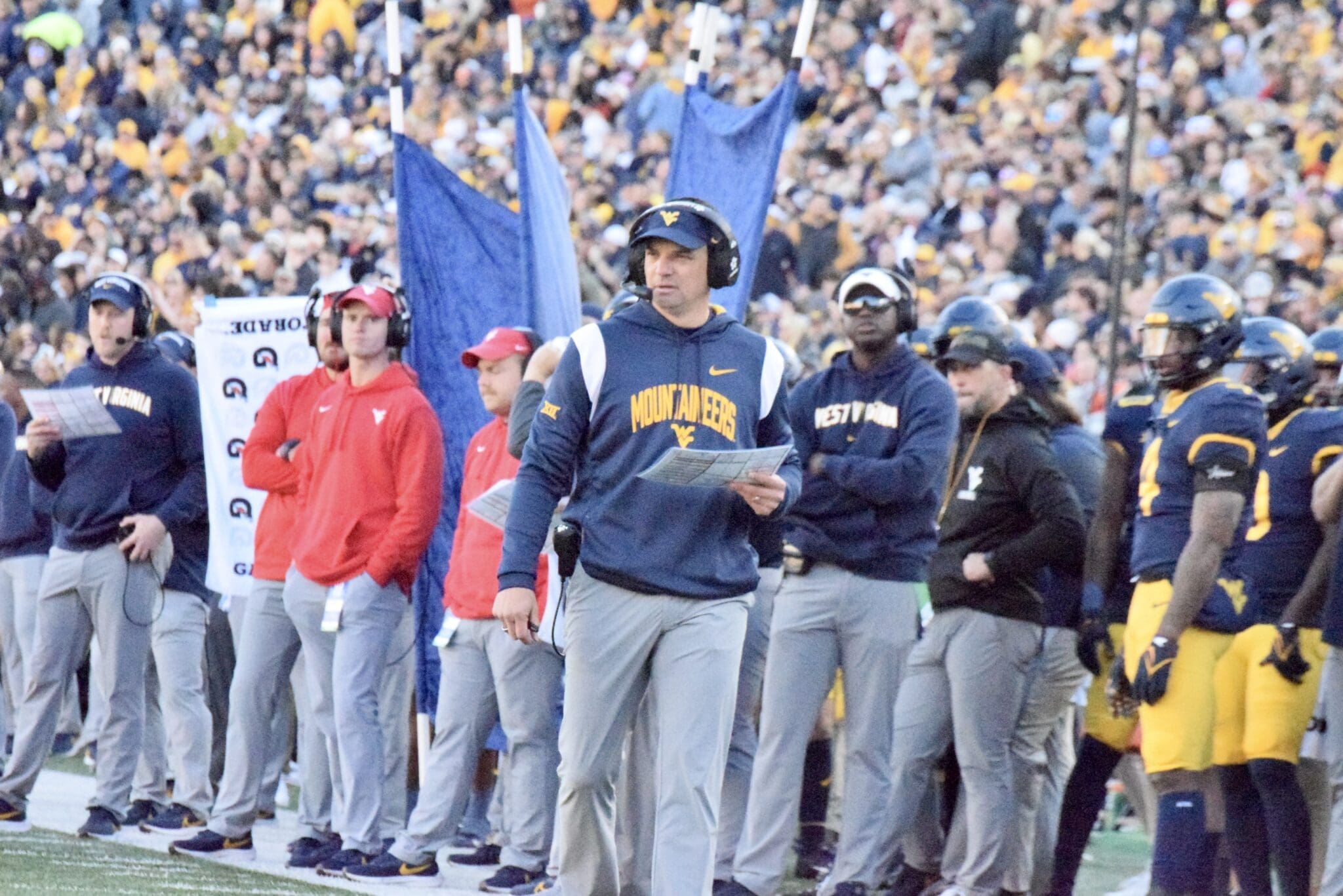 WVU Football HC Neal Brown on sidelines with Bilal Marshall