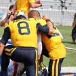 WVU Football Nicco Marchiol and Preston Fox pray before kickoff