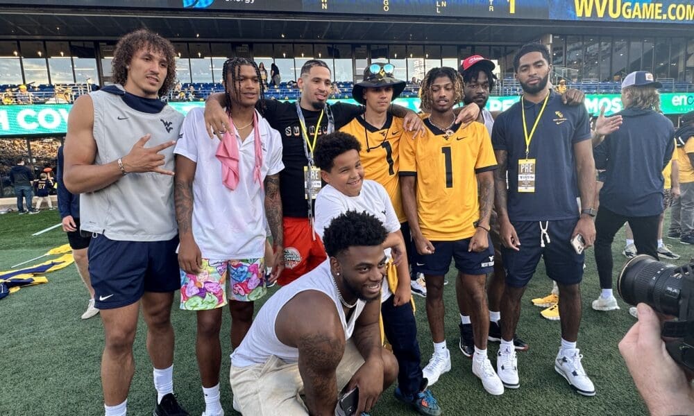 WVU Basketball Players on football field