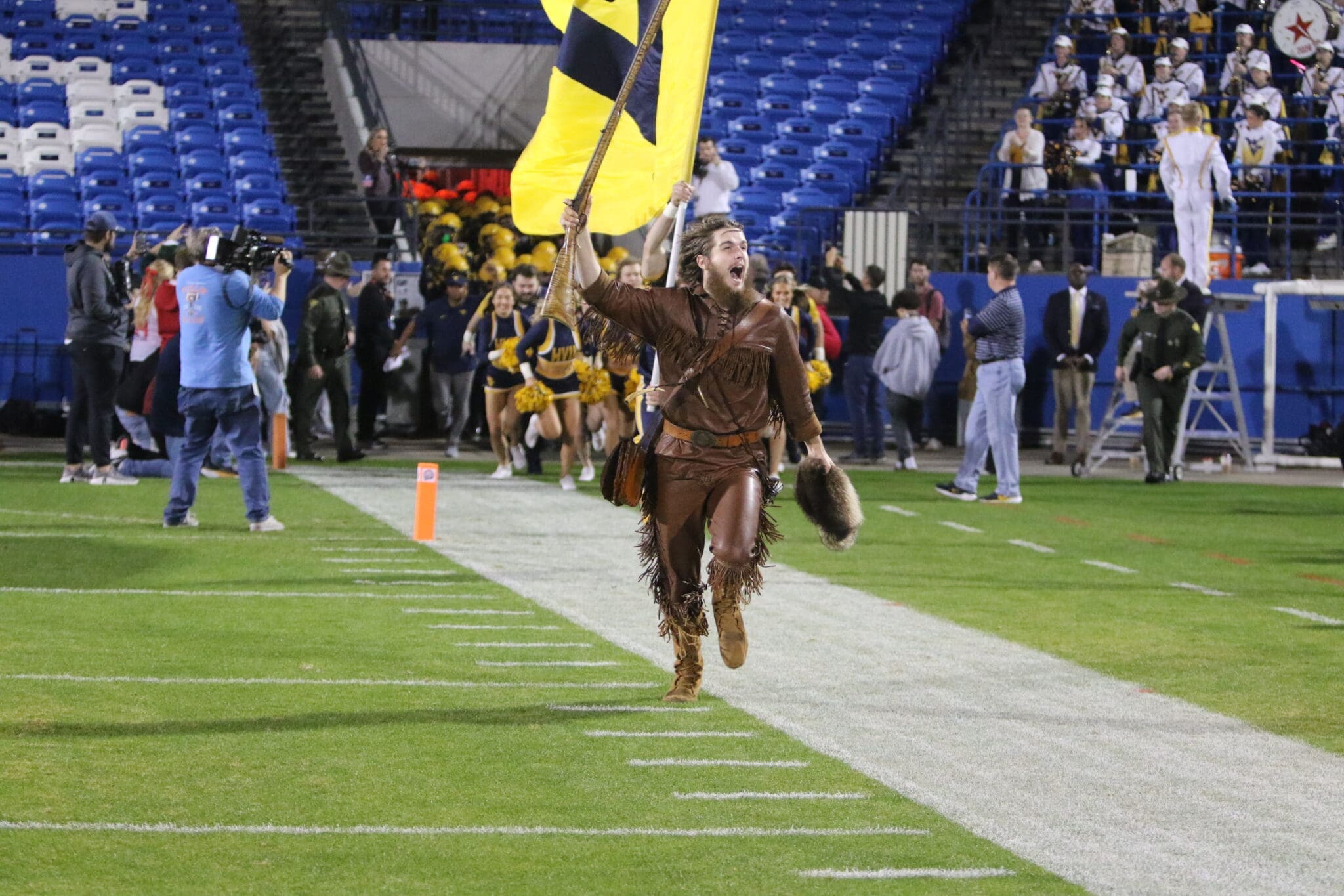 WVU Mascot with flag at Frisco Bowl stock