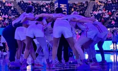 WVU Women's Basketball team huddle