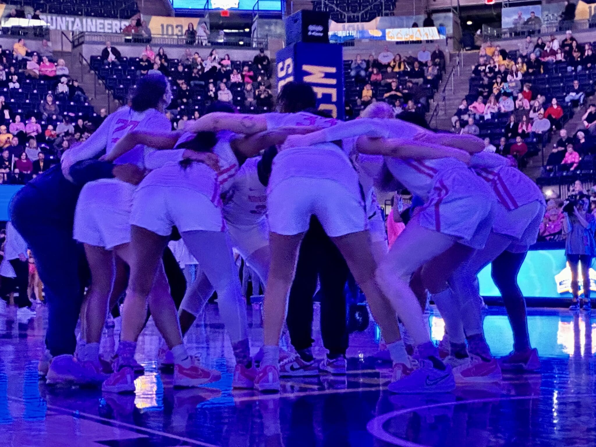 WVU Women's Basketball team huddle