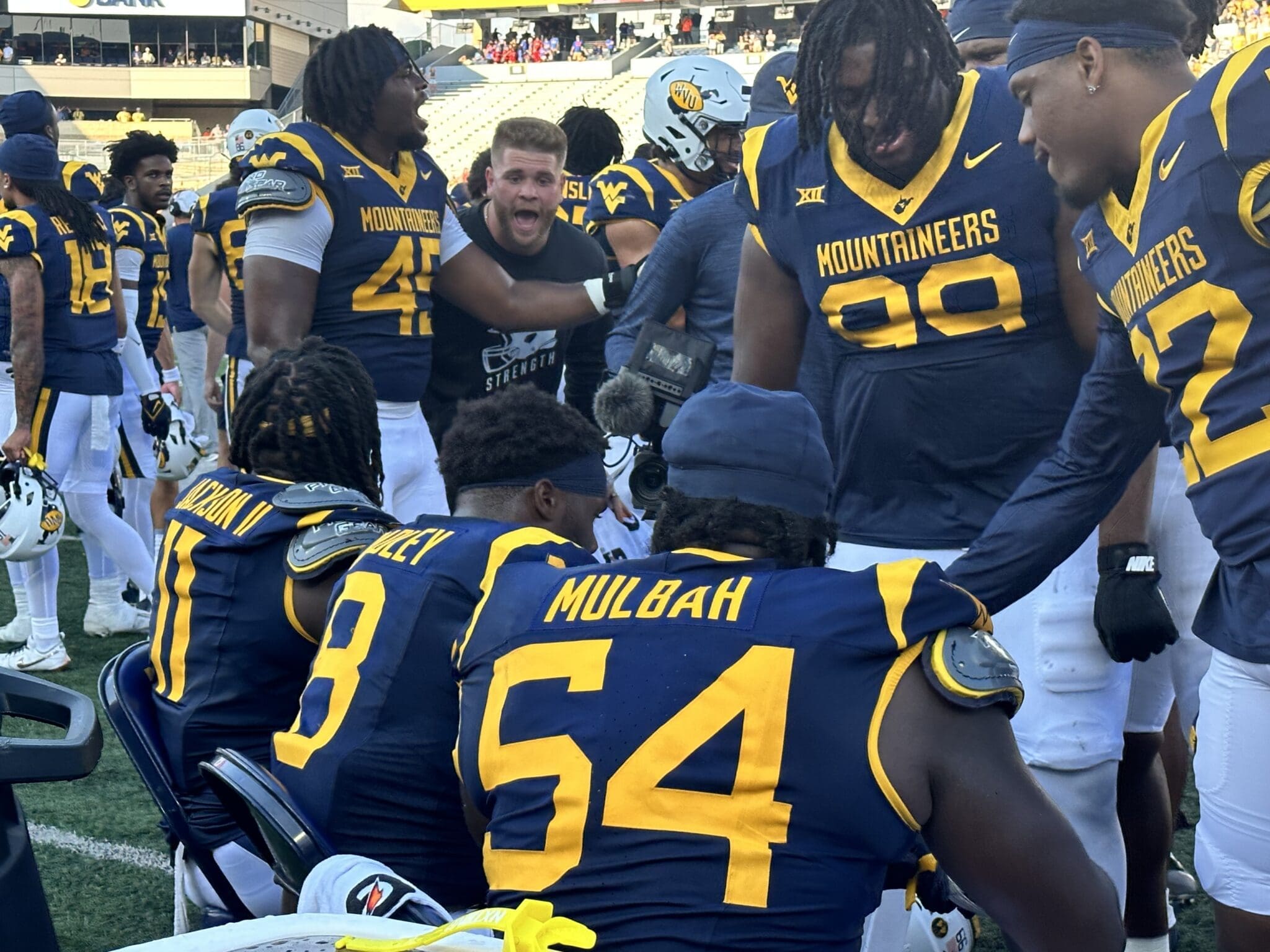 WVU Football Defense Celebrates Stop on the Bench