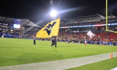 WVU Flag at Frisco Bowl stock