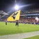 WVU Flag at Frisco Bowl stock