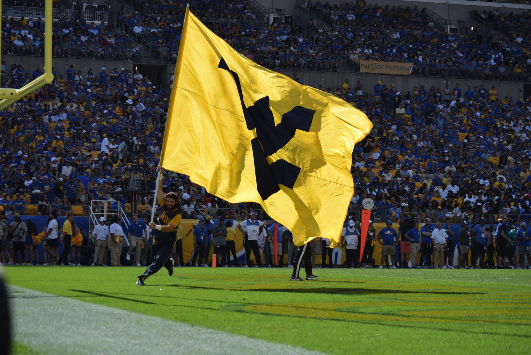 WVU flag in end zone at Pitt stock