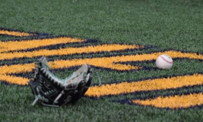 WVU Baseball glove and ball stock