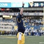 WVU Football QB Garrett Greene celebrates a TD by pointing sky against Cincinnati