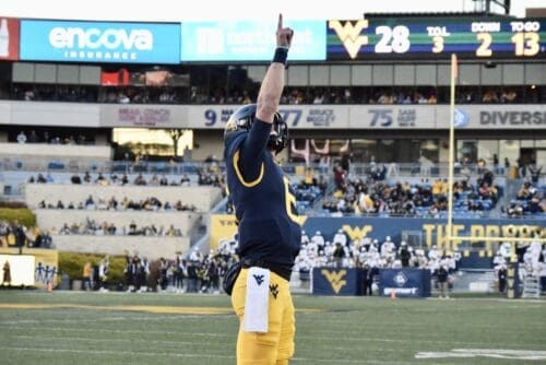 WVU Football QB Garrett Greene celebrates a TD by pointing sky against Cincinnati