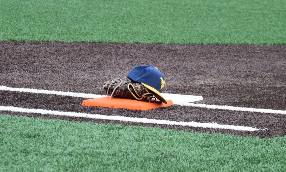 WVU Baseball hat and glove stock