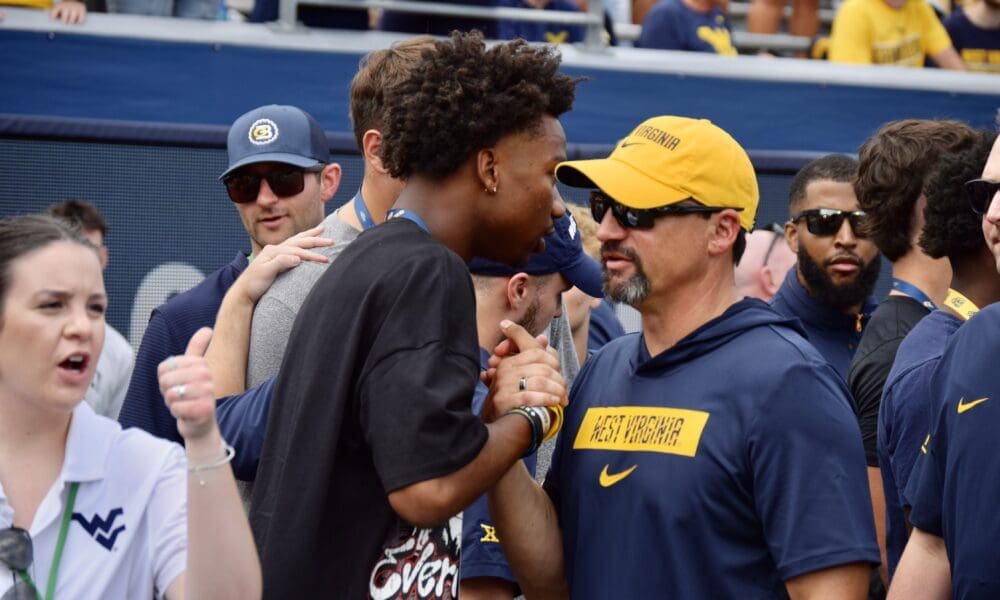 WVU Football HC Neal Brown with recruit