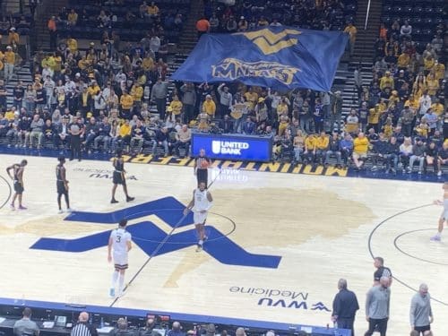 Mountaineer Maniacs flag in crowd at WVU Coliseum