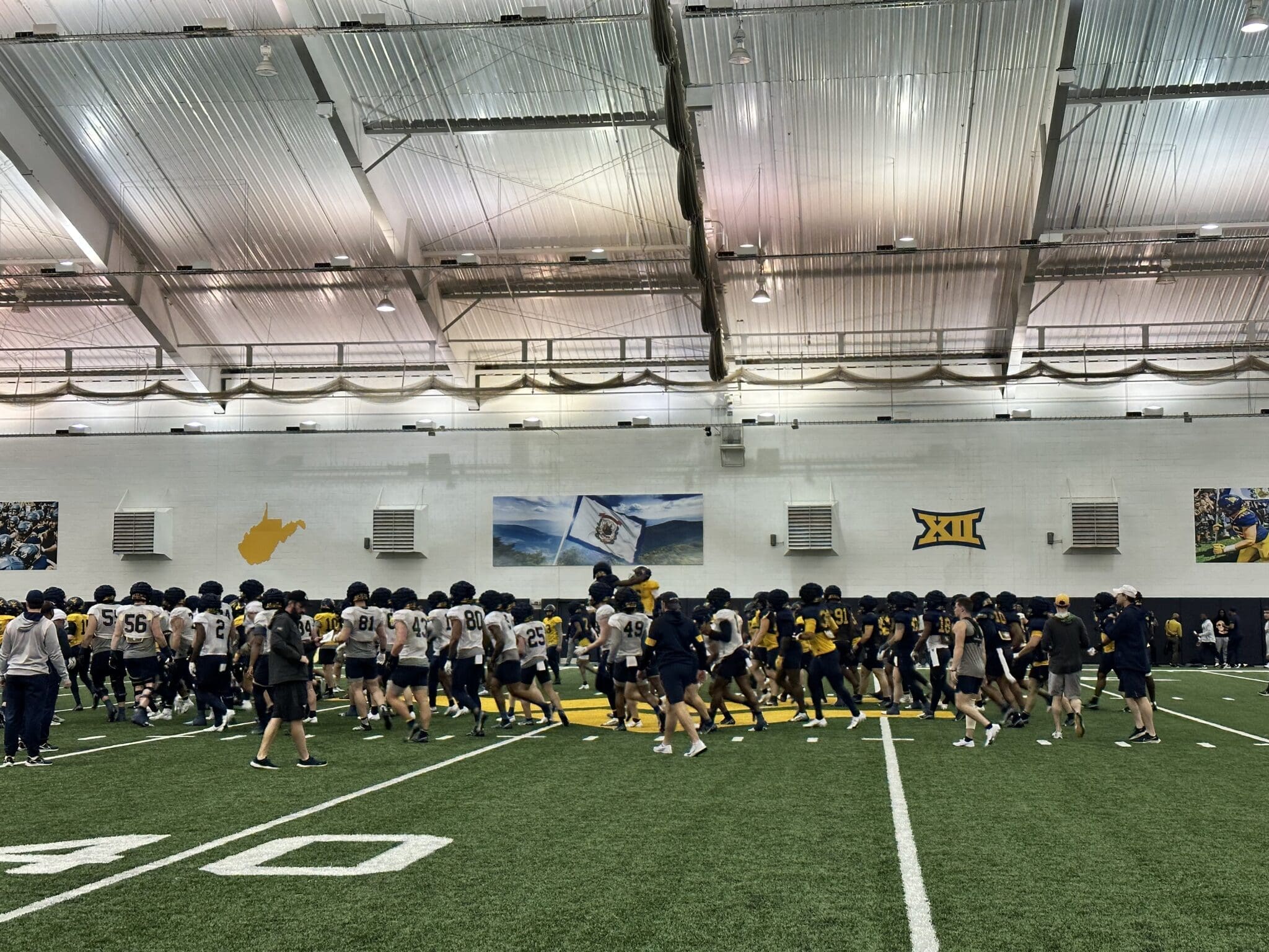 WVU Football with flag