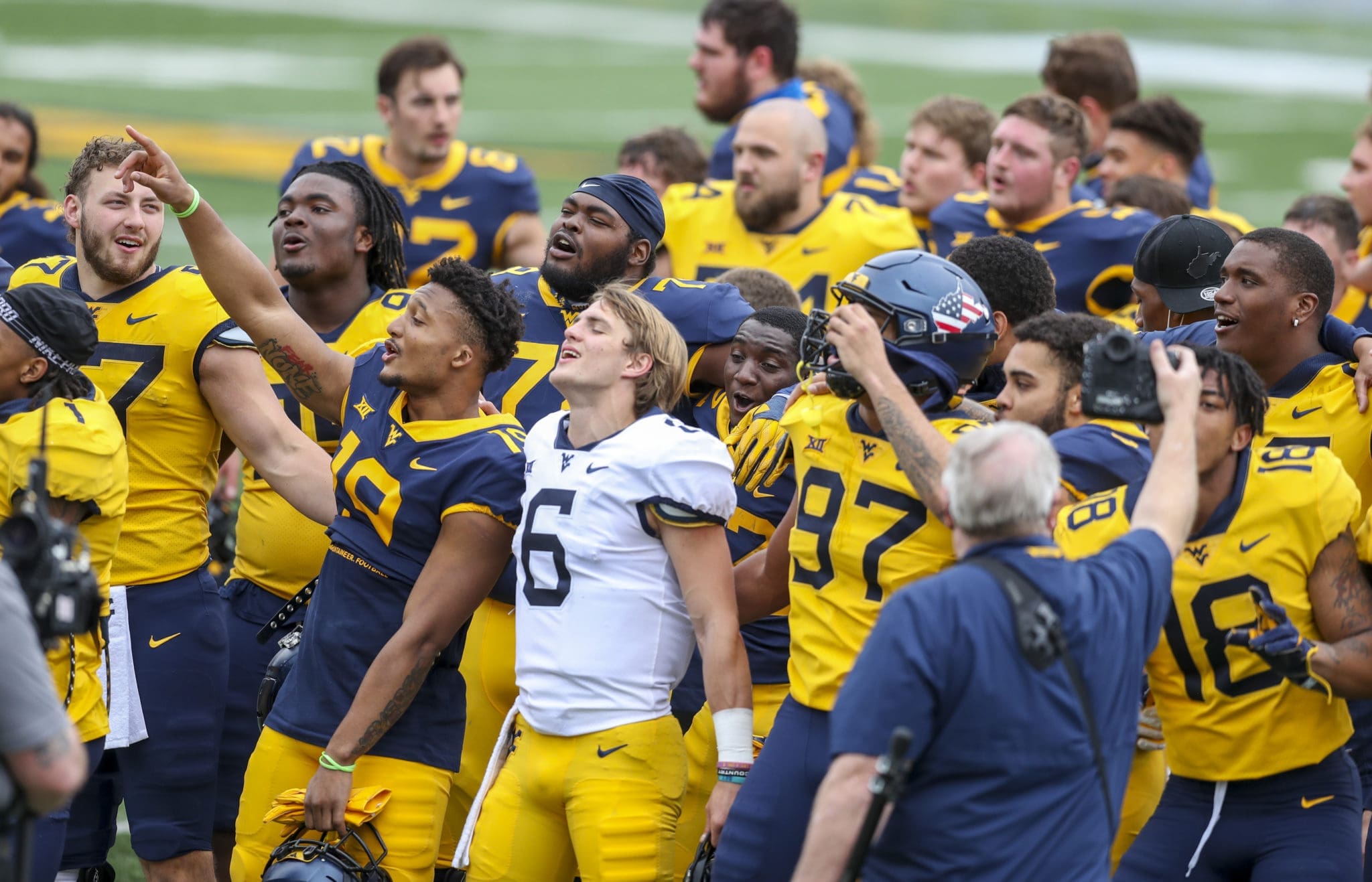 WVU football Garrett Greene and team celebrating after Gold-Blue Spring game