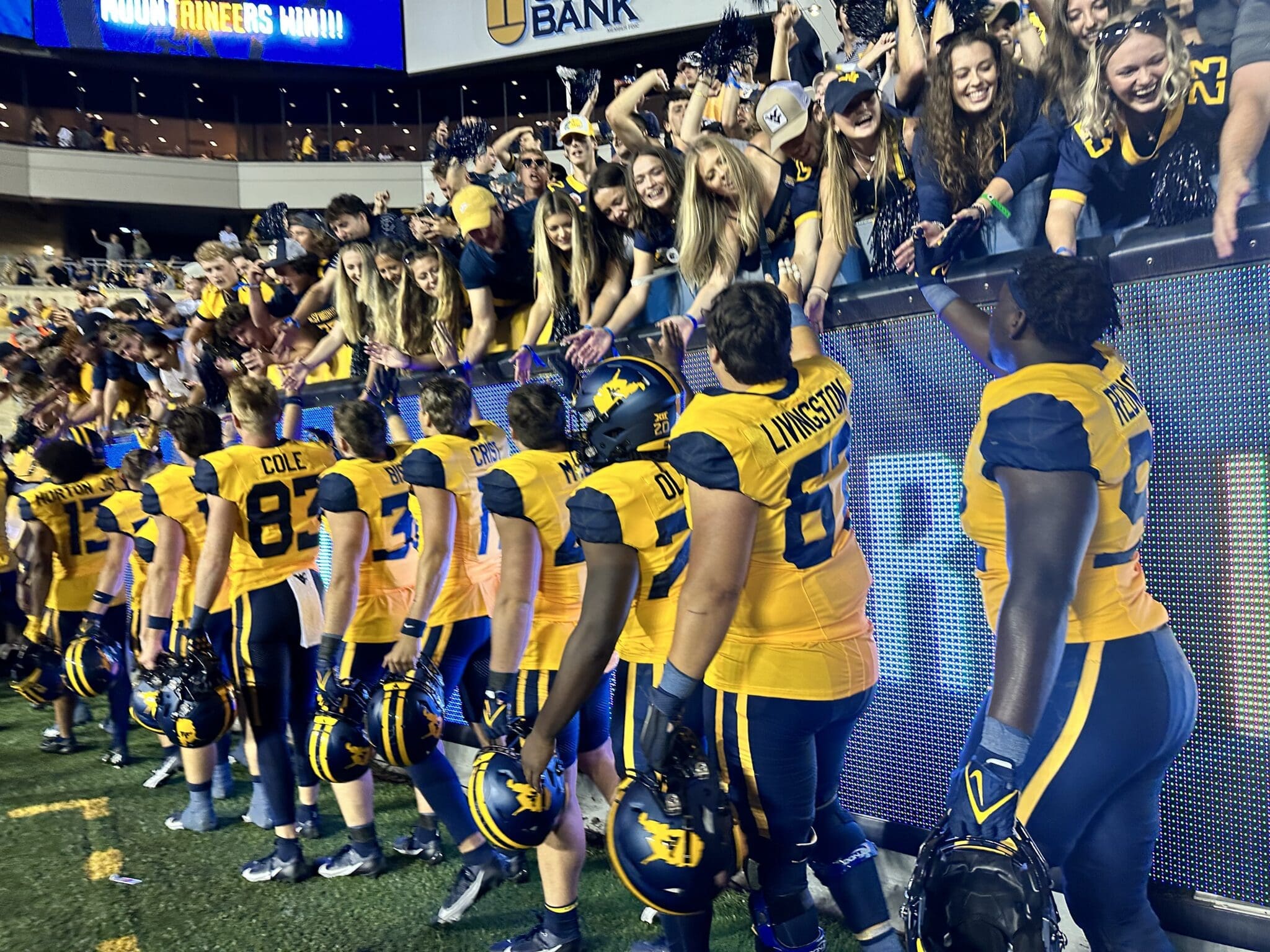 WVU Football players celebrating