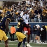 WVU Football Anthony Wilson making a tackle against Cincinnati