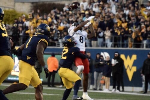 WVU Football Anthony Wilson making a tackle against Cincinnati