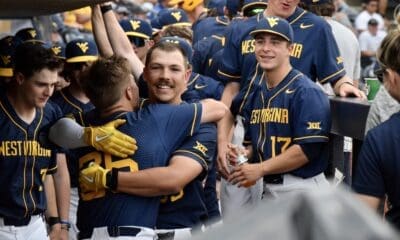 WVU Baseball celebrates Kyle West home run in the dugout