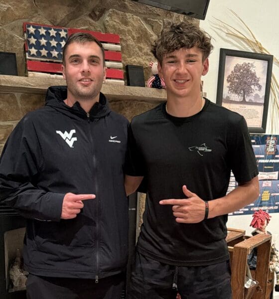 Chase Guers with WVU Football WR Coach Ryan Garrett
