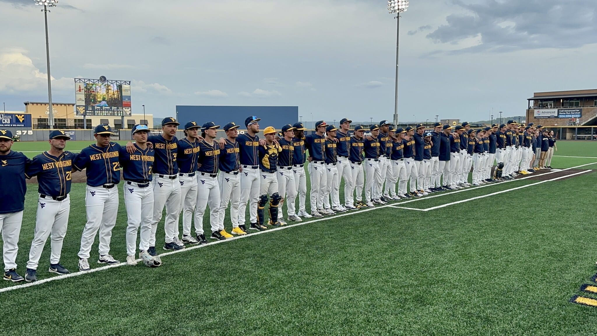 WVU Baseball singing Country Roads and celebrating win