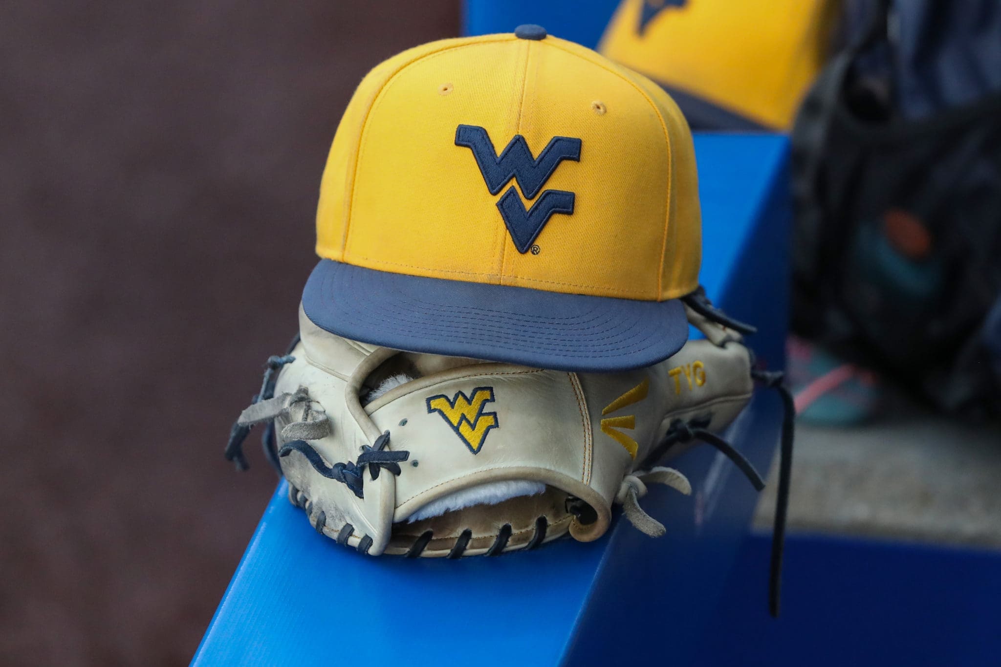 WVU baseball hat and glove stock