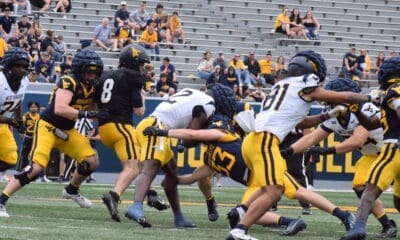 WVU Football Nicco Marchiol tackled at Spring Showcase