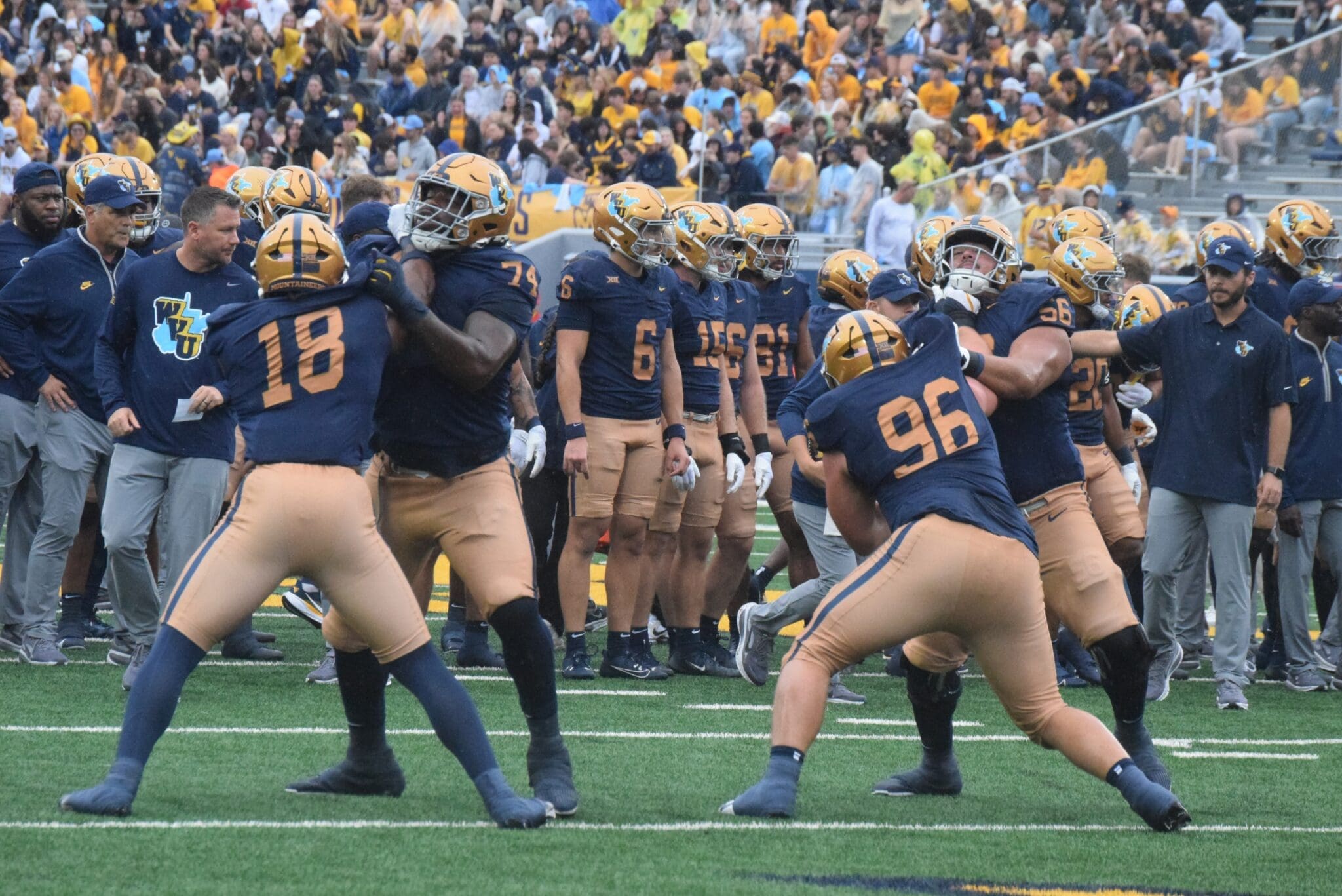 WVU Football players getting ready before Utah game