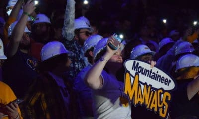 Mountaineer Maniacs sign in WVU basketball crowd