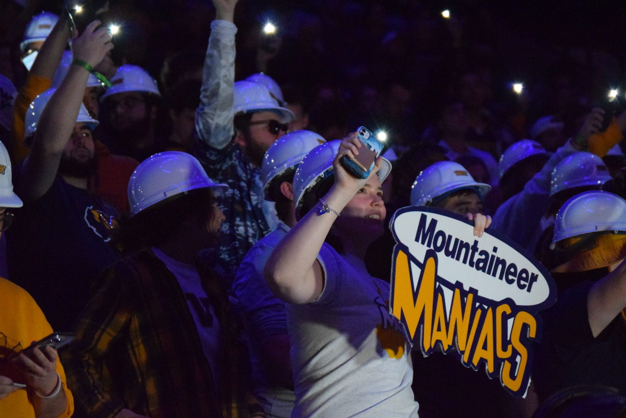 Mountaineer Maniacs sign in WVU basketball crowd