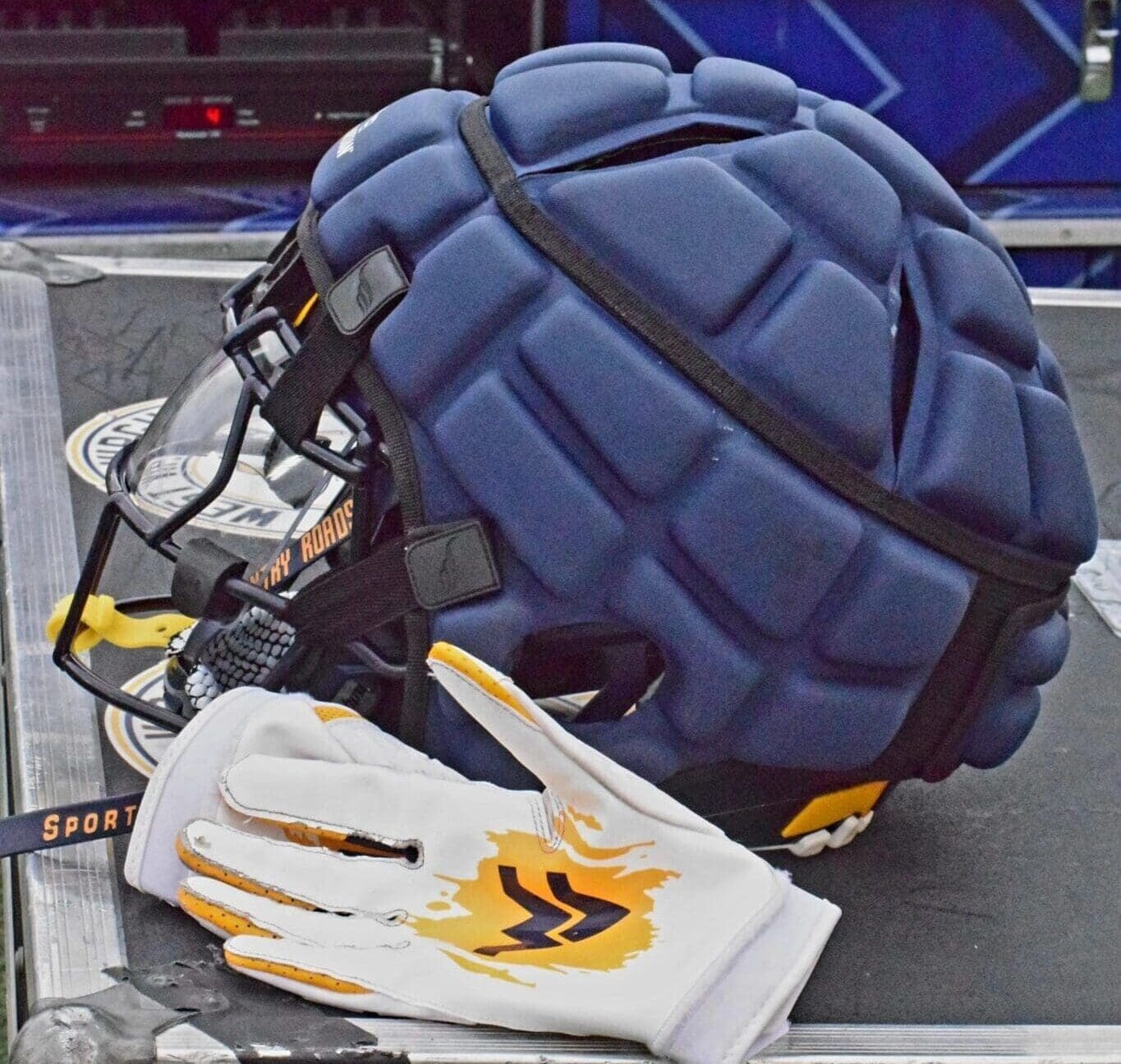 WVU Football helmet and gloves stock