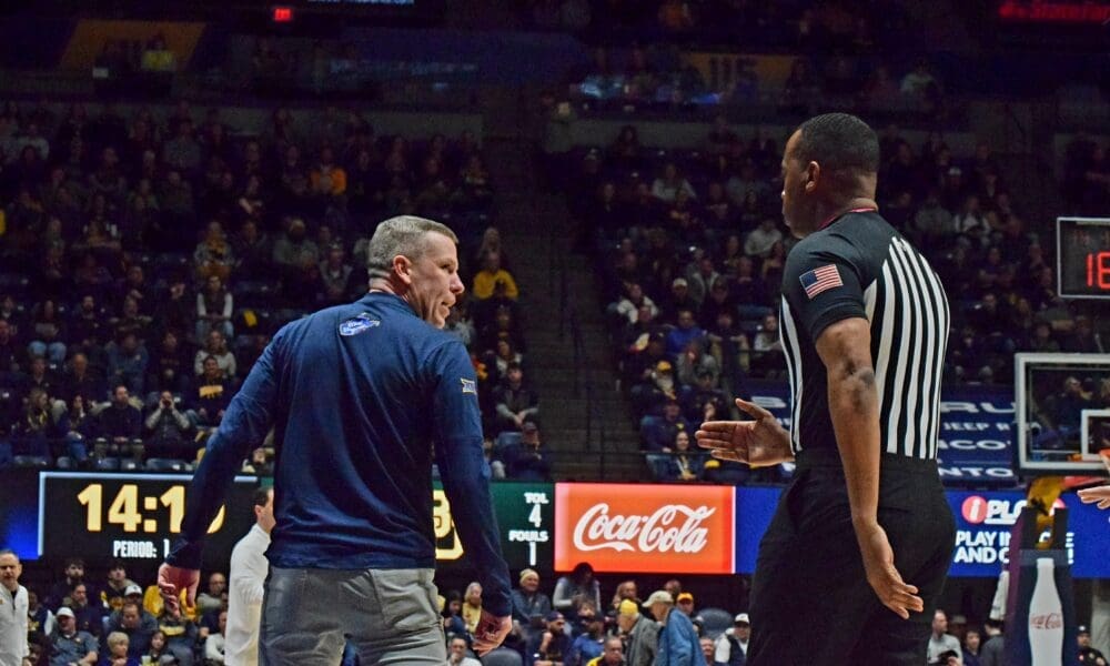 WVU Basketball HC Ross Hodge against Baylor with ref
