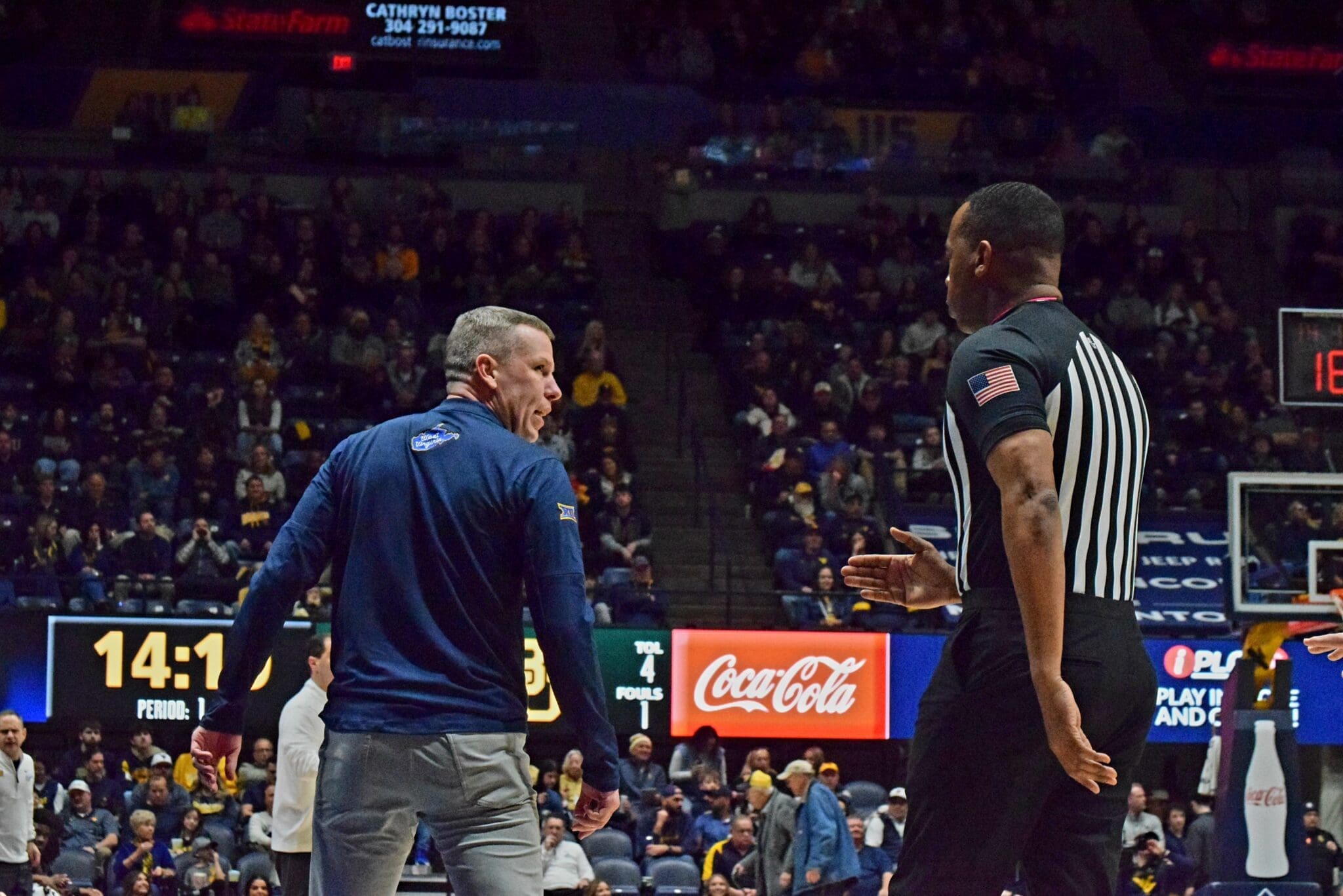 WVU Basketball HC Ross Hodge against Baylor with ref