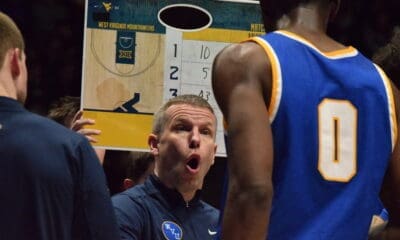 WVU Basketball HC Ross Hodge in huddle