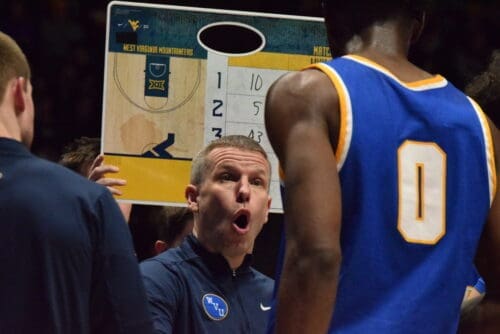 WVU Basketball HC Ross Hodge in huddle