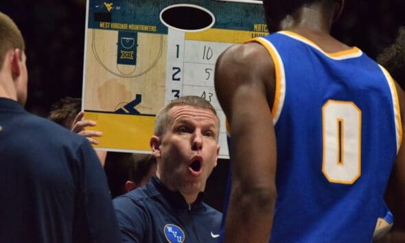 WVU Basketball HC Ross Hodge in huddle