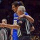 WVU Basketball Harlan Obioha with referee