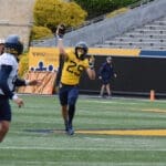 Wide Receiver Preston Fox throws a touchdown to Quarterback Garrett Greene during the Blue Gold Spring Game.