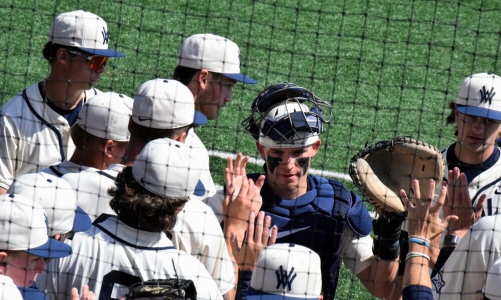 WVU Baseball players high fives